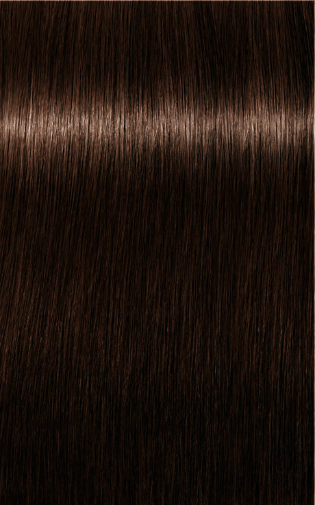 Nuanță de păr brun intens cu reflexii calde și profunzime naturală, ideală pentru un look elegant și sofisticat